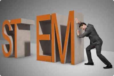 Man pushing giant letters spelling stem, symbolizing him trying to close the "stem gap"