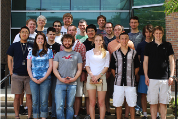 A group picture of the 2013 Physics and Engineering Physics graduates at The Ohio State University. The background is the exterior of the Physics Research Building.