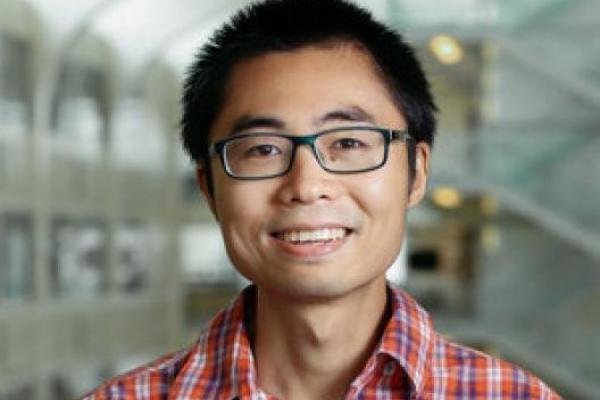 Yuanming Lu smiling in front of PRB Atrium