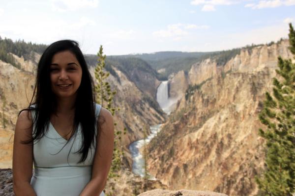 Headshot of Niharika Sravan in front of a waterfall