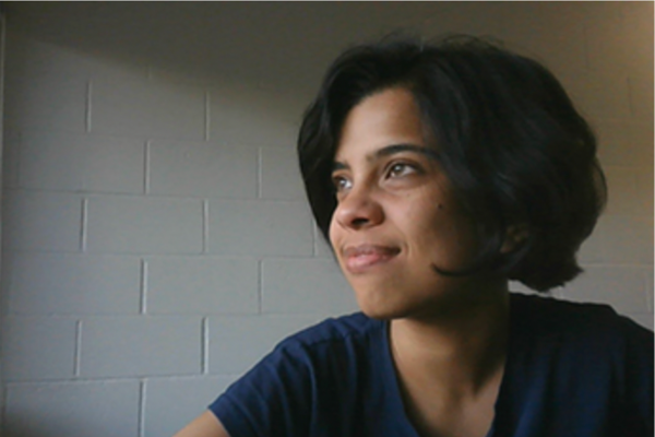 Srimoyee Sen smiling and looking off into the distance