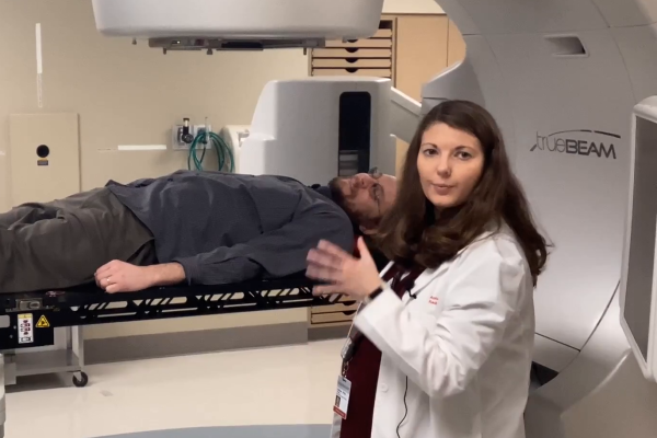 Chris Orban lying in an MRI machine as part of demonstration