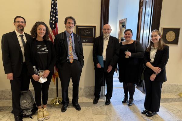Professor Mike Lisa and student Josie Rose standing in front of senator's office