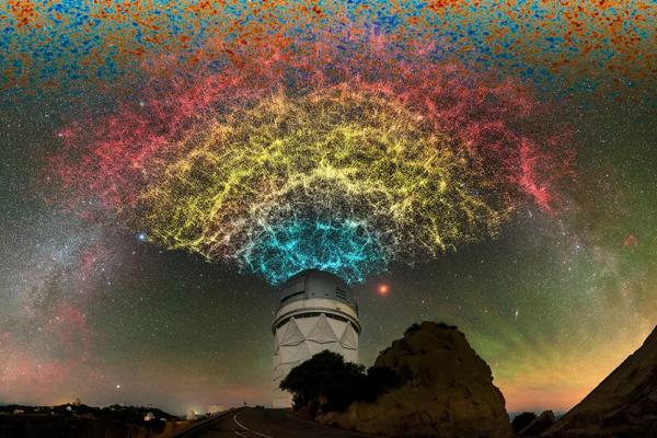 Large telescope with colorful patterns of light across the sky