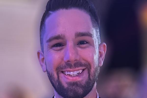 Close up of Daniel Brandenburg smiling with blurred background