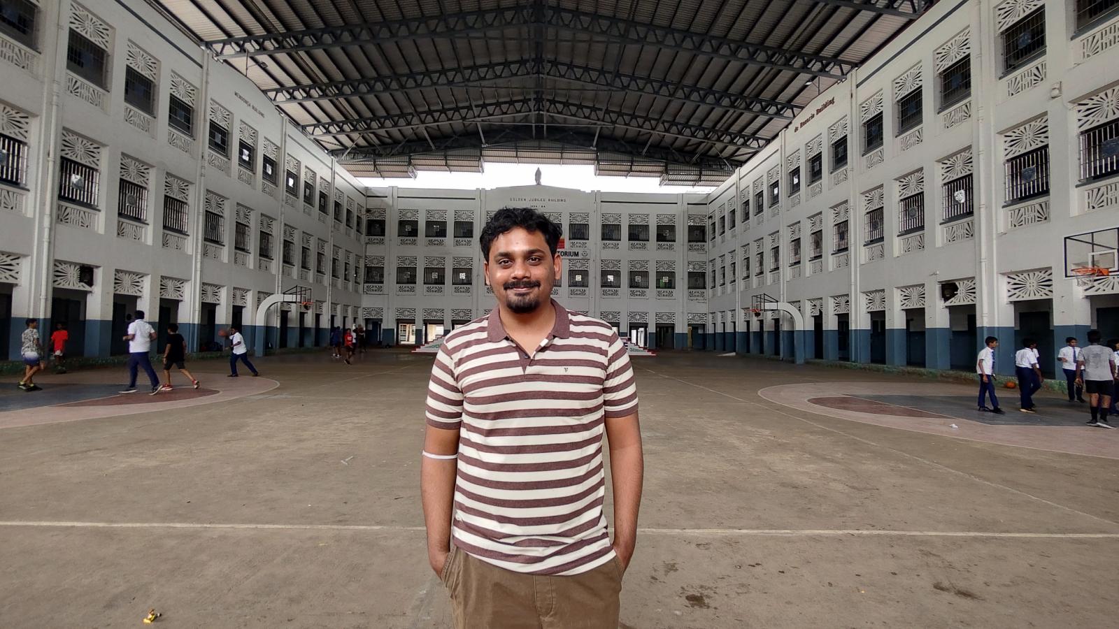 Rahul Standing in front of building