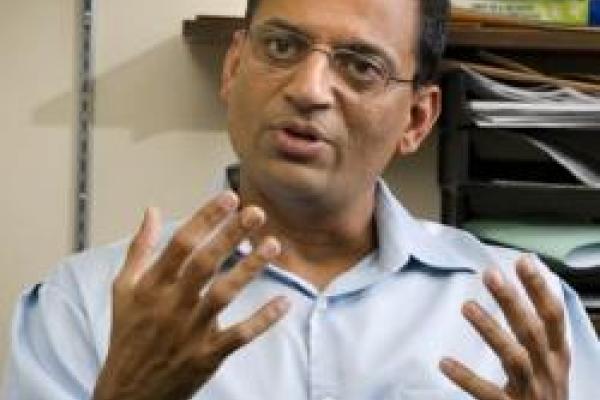 A picture of Mayank R. Mehta talking.