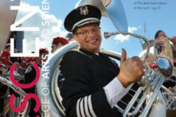 Cover of ASCent magazine with OSU marching band member smiling and giving thumbs up