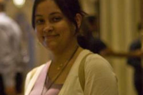 Shreyashi Chakdar smiling with blurred out hallway behind her
