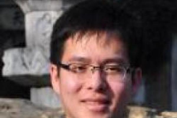 Chi Xiong with stone structure behind him