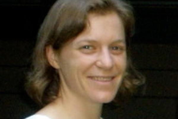 A headshot of Jenny Hoffman (Harvard University) with a black background.