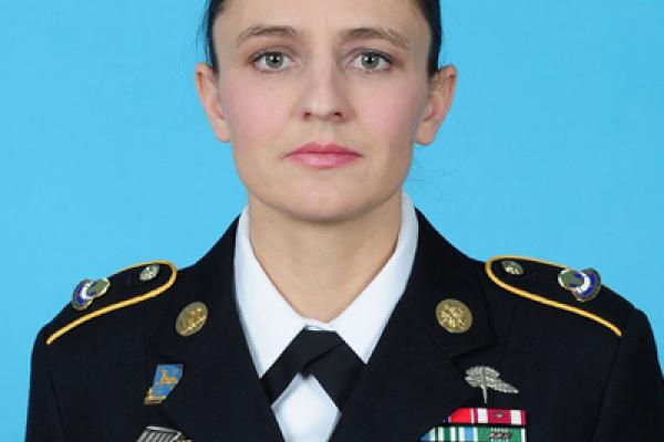 headshot of Khalida Hendricks with a blue background