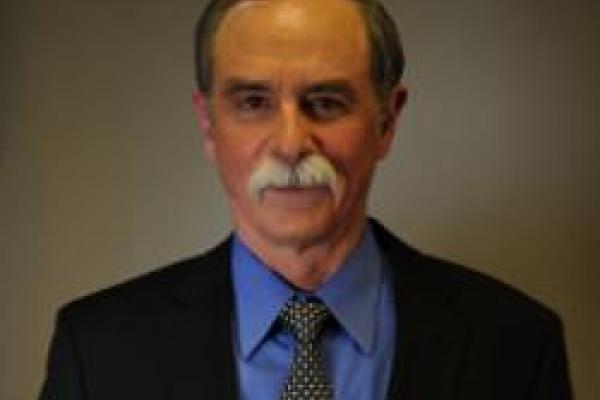 David Wineland with dark, brown background