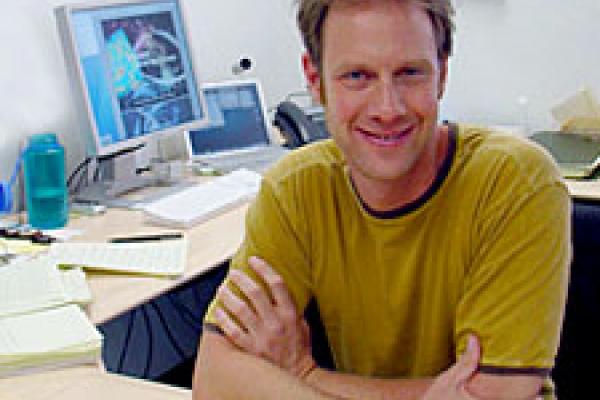 A picture of Sean Fleming at an office desk.