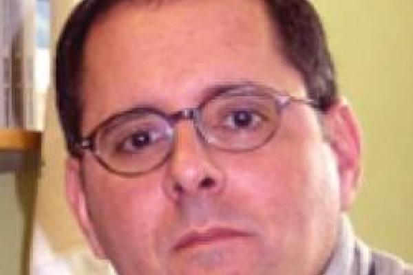 Professor Lou DiMauro against yellow background
