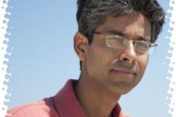 Piyush Kumar with light blue background and white background