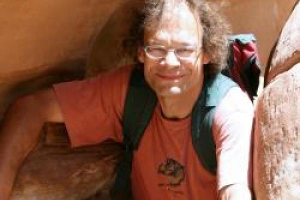 A picture of Thomas Vojta hiking between rocks.
