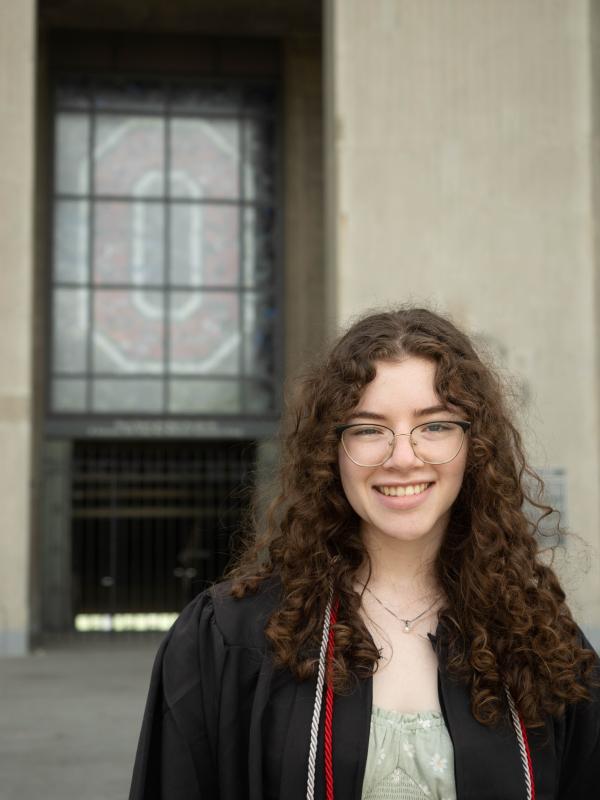 Allison Lucas in graduation gown in front of Ohio Stadium