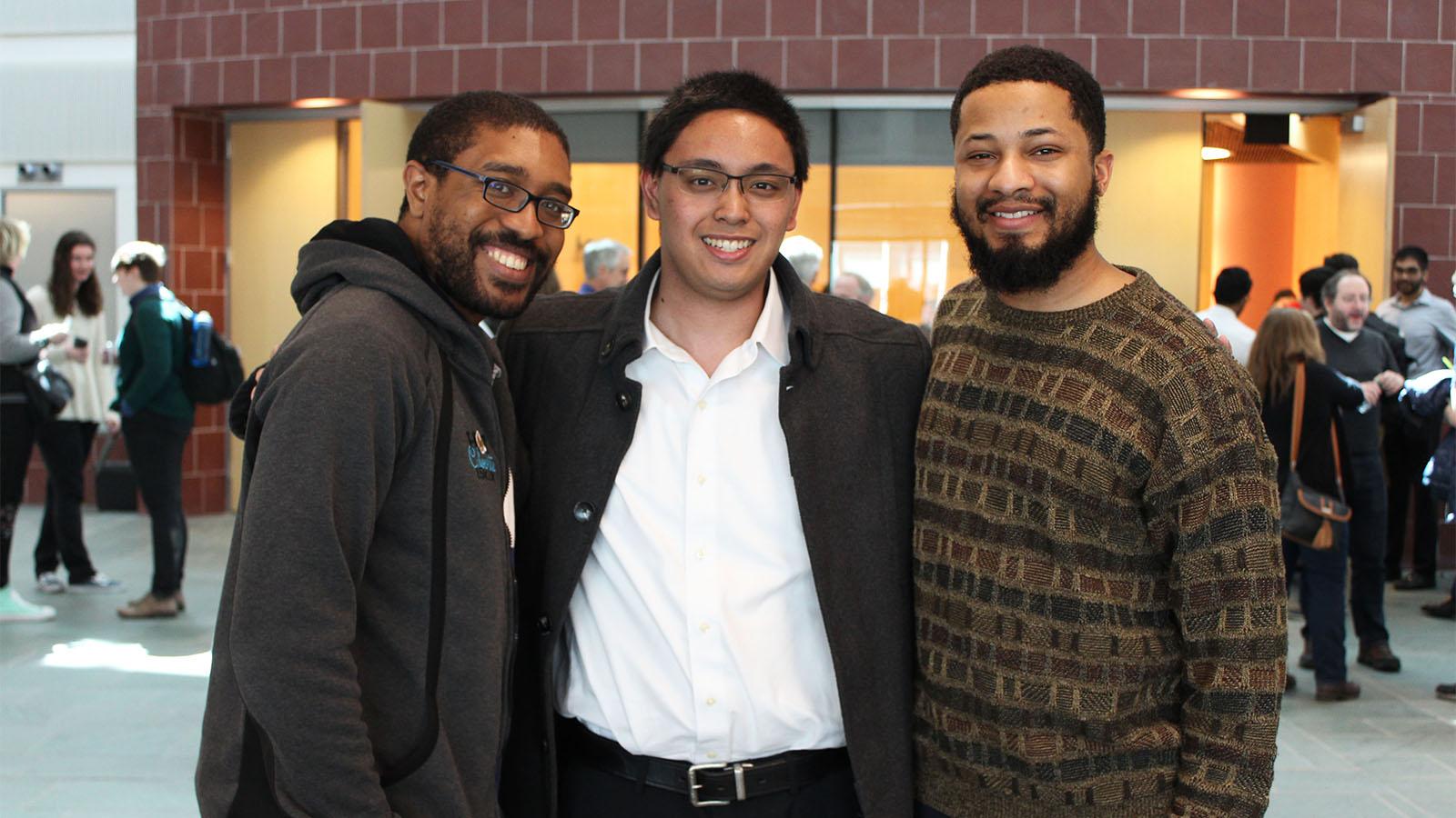 Three students inside the Physics Research Building