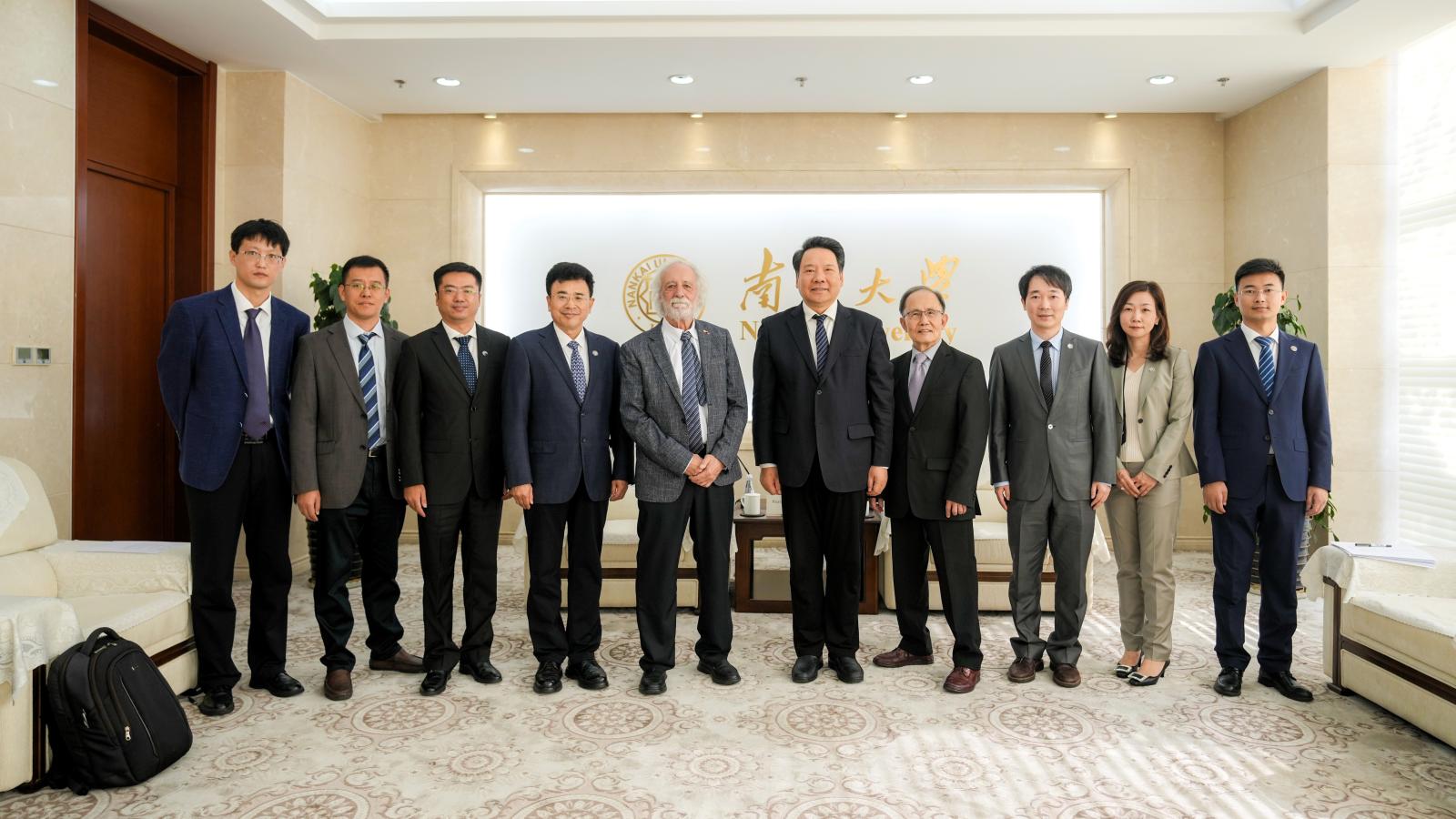 Pierre Agostini with President Yulu Chen and other University leaders