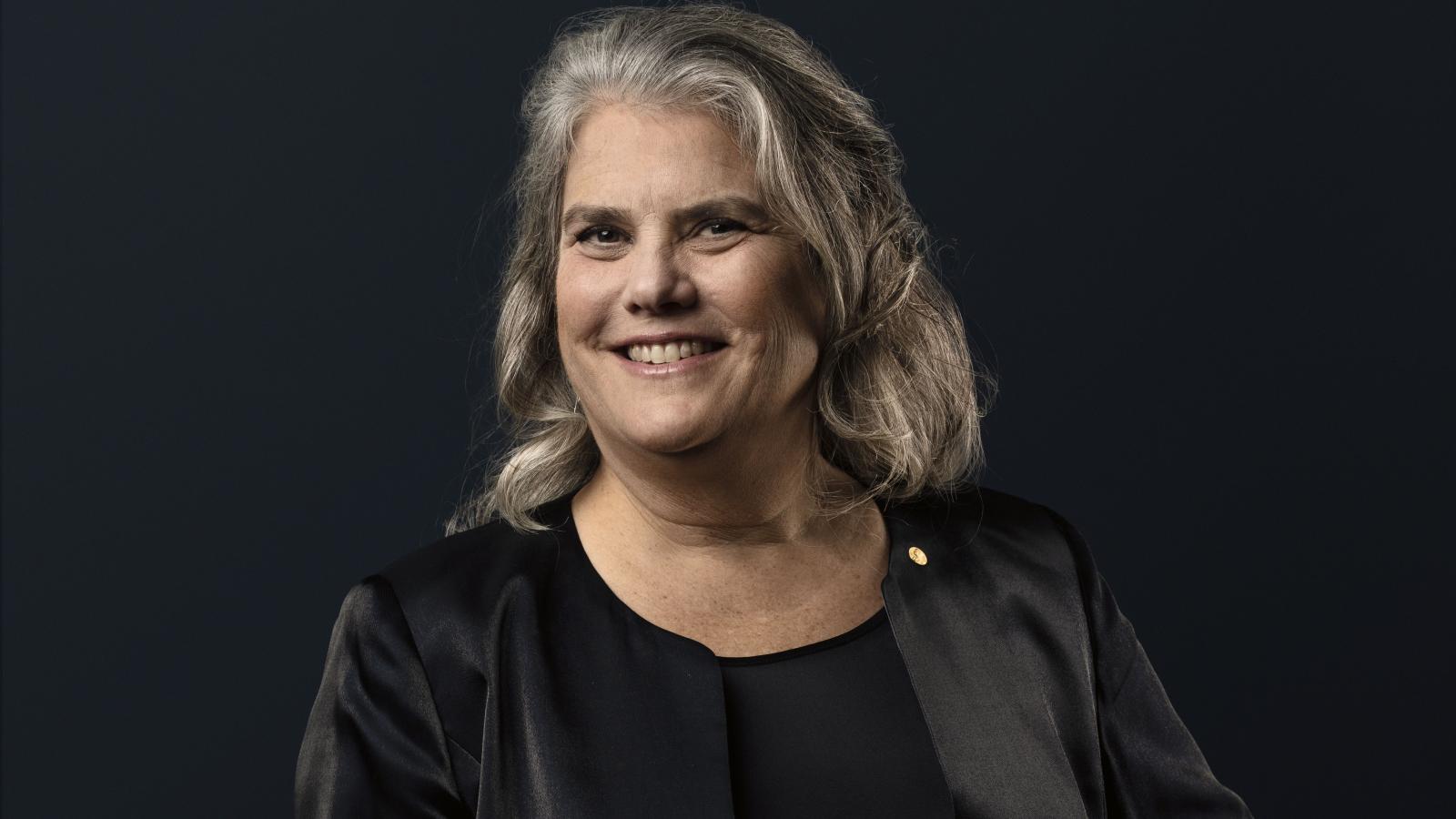 Andrea Ghez in front of a black backdrop