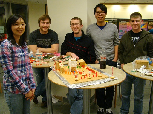 Students with gingerbread houses.